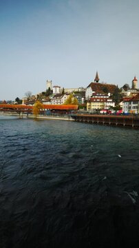Static shot of the Reuss river, Spreuer Bridge and medieval Musegg Wall in Lucerne, Switzerland