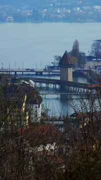 Static shot of the historic Chapel Bridge and Water Tower on the Reuss river, Lucerne, Switzerland