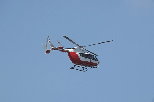 Eurocopter 145 helicopter (tail number RA-01882) on a blue sky background
