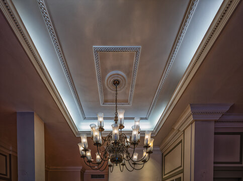 Interior Portrait on a Wrought Iron and Glass Chandelier.