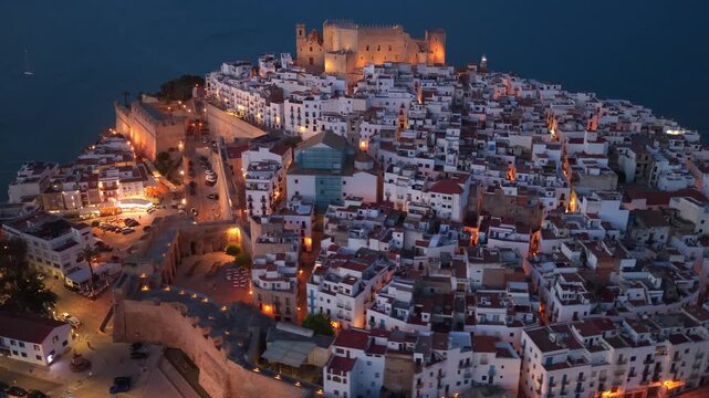 Peniscola at night, aerial view, drone shot of Spanish resort town of Peniscola with night illumination, vacation in Peniscola, Valencia Provence, Peniscola castle in Spain