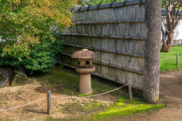 Naklejka premium Stone Lantern (ishi-dore) in the Koko-en Garden on a sunny autumn day, Himeji, Hyogo Prefecture, Japan