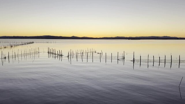 Fishing Traps on Lake at Sunset Scenic Waterscape in Spain
