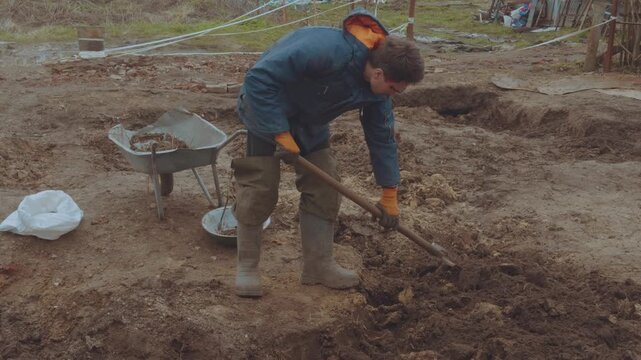 Cleaning the soil from stones, digging the earth, filtering the earth