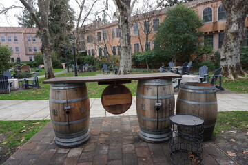Obraz premium closeup on old wine wood barrels bar in a resort in napa/sonoma valley, ca, usa