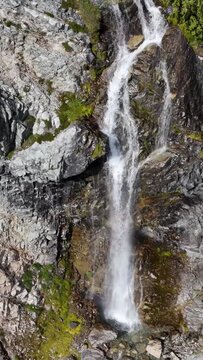 Majestic Waterfall Cascading Down a Rocky Mountain in Beautiful British Columbia, Canada