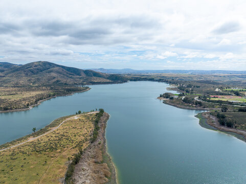 Aerial view of Otay Lakes County Park in Chula Vista, California, a scenic view of a mountain range, the lake. High quality photo