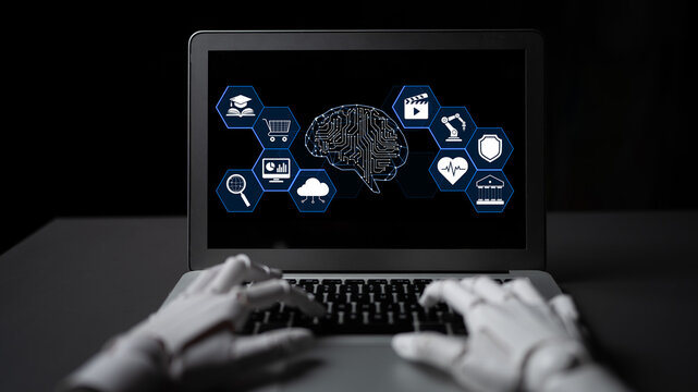 Futuristic technology representation with robotic hands interacting with a laptop displaying artificial intelligence and digital icons on screen Quark.