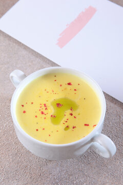 Yellow cream soup made from fresh pumpkin and corn. The concept of an autumn lunch. The menu in the cafe. A dietary and healthy dish.