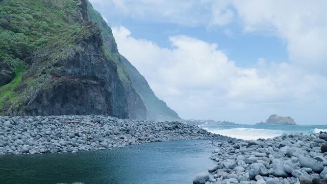 Scenic view of ribeira da janela river meeting the ocean in madeira