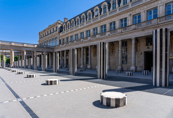 Naklejka premium Paris, France - 04 25 2026: View of the courtyard of the honor gallery in the National Estate of the Palais-Royal with Columns and buildings