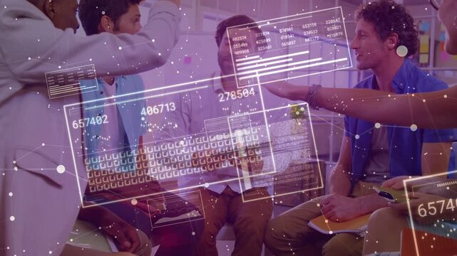 Team sitting in office, tablet sparking business action, hands stacking, panels showing numbers