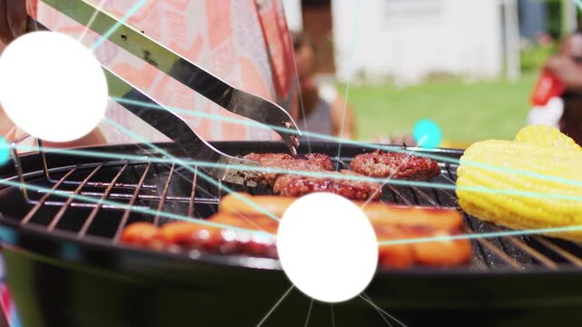 Griller using tongs lifting and flipping burger at barbecue, animated dots showing doneness