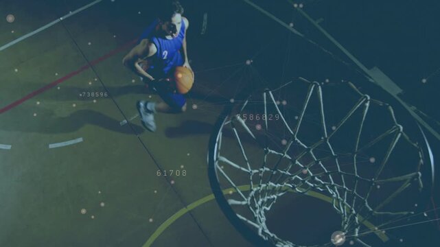Male athlete dribbling and driving toward rim overhead, sports overlay tracking shot aiming score
