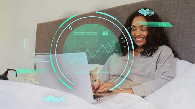 Woman typing in bed, kitten appearing climbing keyboard, tech HUD graphs over laptop, on break