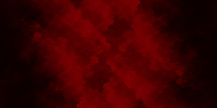 Dynamic red and black smoke swirls in a dark motion blur with hot orange fire and inferno light textures to create a grunge burning explosion backdrop design