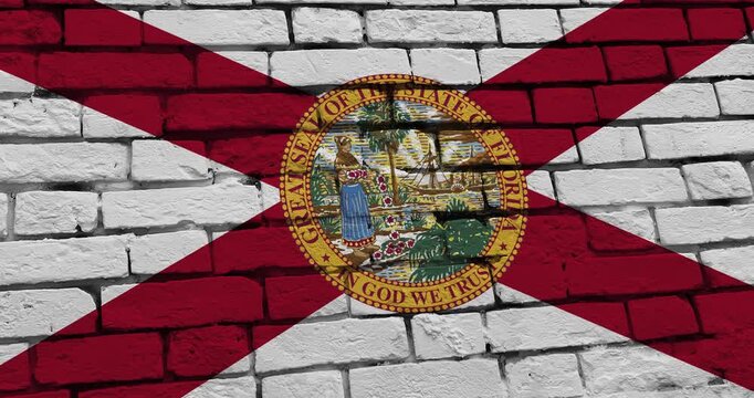 A panning video of a brick wall with the florida state flag of the United States of America