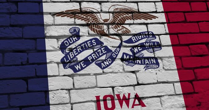 A panning video of a brick wall with the iowa state flag of the United States of America