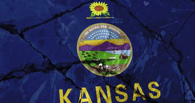 A panning video of a cracked wall with The kansas state flag of the United States of America