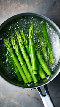 Green asparagus spear veggies blanching boiling pot water