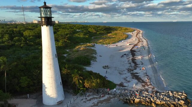  Aerial film recording a lighthouse on the beach coast in the afternoon 