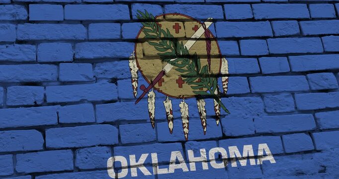A panning video of a brick wall with the oklahoma state flag of the United States of America