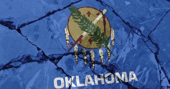 A panning video of a cracked wall with The oklahoma state flag of the United States of America