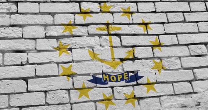 A panning video of a brick wall with the Rhode Island state flag of the United States of America