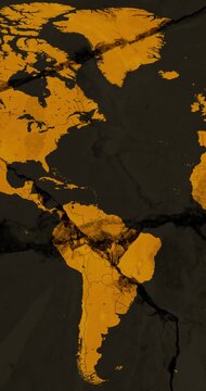 A panning vertical video with an orange world political map over a brown cracked wall