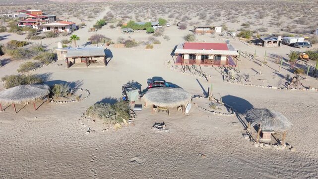 Aerial morning views of campsite at Bahia De Los Angeles in Baja California, Mexico, showcasing beaches and camping spots near the water with teardrop camper trailer.
