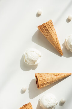 Vanilla Ice Cream Cones with Scoops on White Table