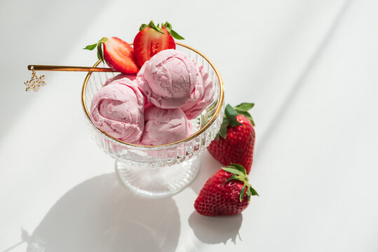 Strawberry Ice Cream with Fresh Strawberries on White Table