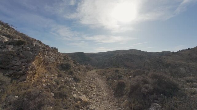 Point of view hiking on a rocky mountain trail