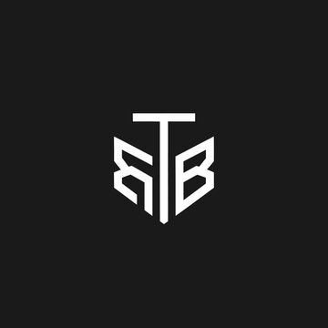 Abstract geometric monogram logo featuring stylized letters R, T, and B in white on a sleek dark background. Minimalist brand identity concept.