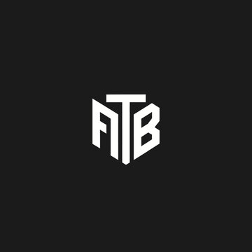 Clean white ATB letter combination in a modern polygonal emblem shape on a solid dark black background, abstract minimalist design.