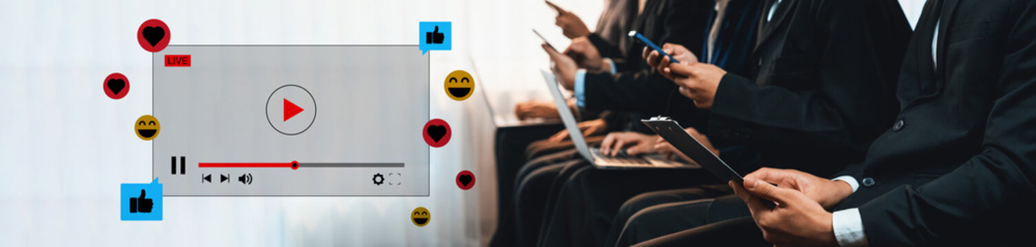 A dynamic scene showcasing audience engagement during a video presentation, highlighting the use of technology, social media reactions, and professional interaction in a modern setting. Ledger