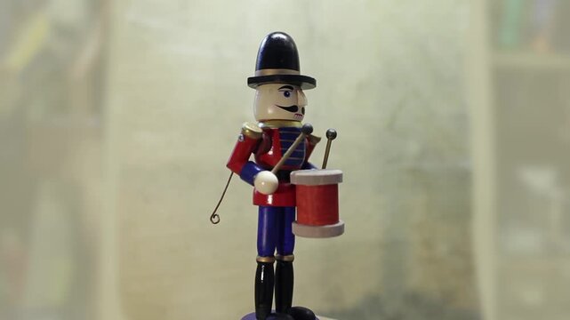 wooden toy, soldier drummer with drumsticks turns around