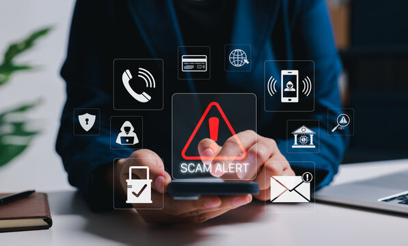 Scam alert and mobile fraud prevention security concept. Person using smartphone with warning, hacker, call, email and payment icons. phishing detection, cyber risk awareness, digital fraud protection