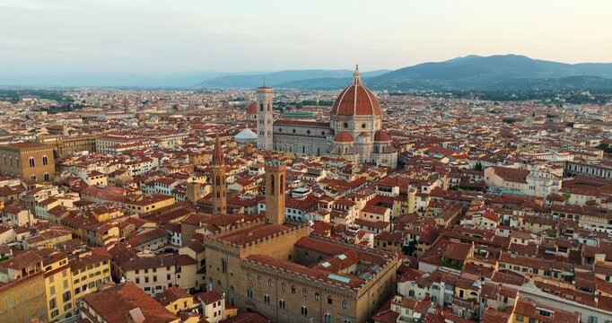 Aerial drone panorama Florence Italy historic old town landmarks Cathedral Duomo red roofs pattern summer daylight travel tourism Tuscany scenic urban view