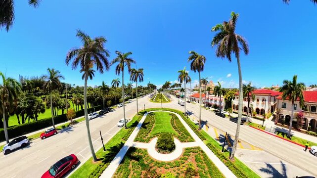 Aerial pull out rising clip Royal Poinciana Way Medians garden Palm Beach Florida