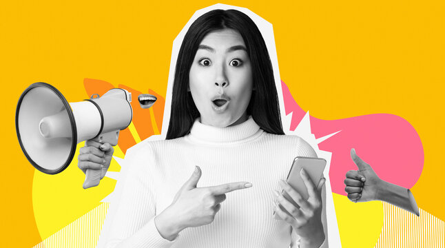A young woman with long dark hair points at her smartphone with a look of surprise and delight. She wears a white sweater and the bright yellow background adds to her expression.