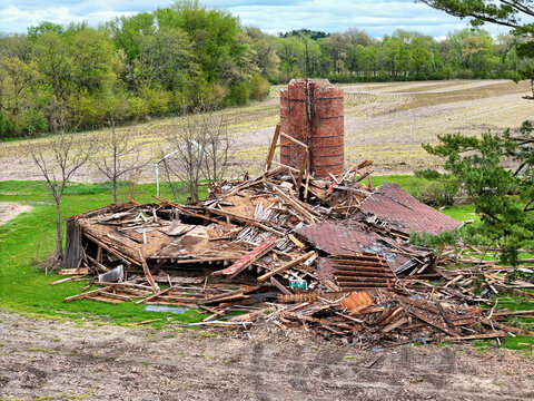 Tornado destroyed barn and silo, complete loss.