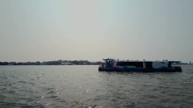 The Kochi Water Metro is a modern, eco-friendly transit system, featuring white and blue electric catamaran boats that glide quietly through Kerala&rsquo;s backwaters. No logo or property visible.
