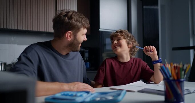 White Father Encouraging Son With Smile Supportive Dialogue Playful Confidence Bright Pencils