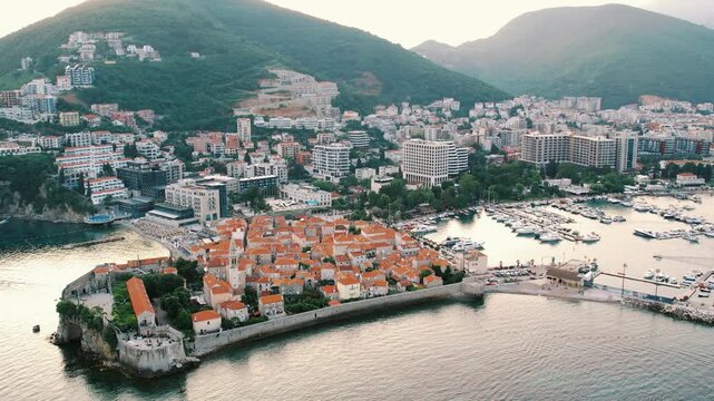 Marina morning scene. Sunrise over bay with bustling docks. Serene aerial view of port at dawn showing activity