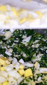 Spring radish and eggs salad. Fresh Easter salad with boiled eggs, cornsalad lettuce and radish. Stock footage video 4k