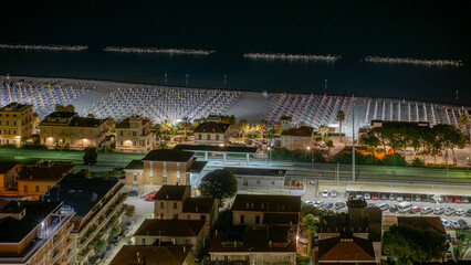 Fototapeta premium Night vision of Cupra Marittima and its beach. Acoli Piceno, Marche, Italy