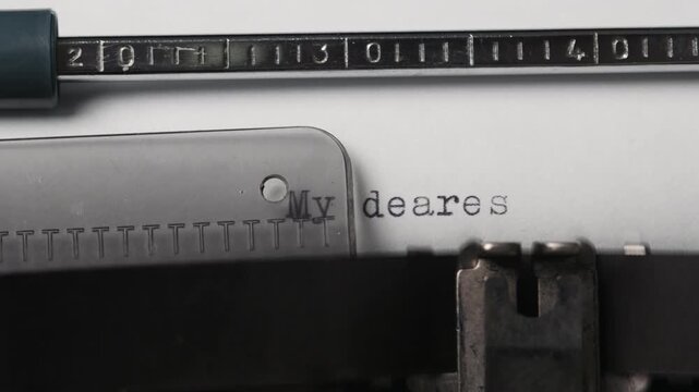 Typewriter with a letter starting with My dearest friend on white paper in a simple workspace during daytime