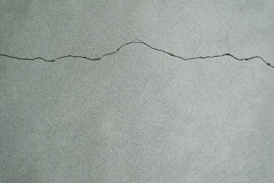 horizontal crack in a concrete wall. horizontal cracks are generally considered more serious than vertical ones, as they often signal that the wall is under excessive lateral (sideways) pressure 