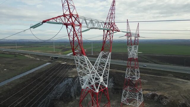 Technical drone inspection of power tower electrical installations, high-voltage insulators and power lines.